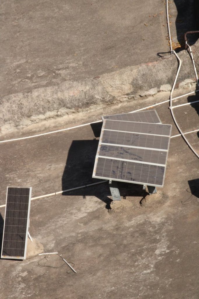 The Art of Drawing Readers In: Your attractive post title goes here Aerial shot of solar panels on a rooftop in Badami, India under bright sunlight.