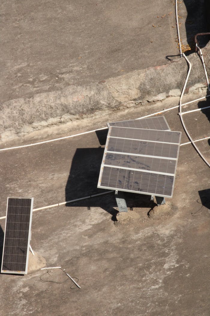 The Art of Drawing Readers In: Your attractive post title goes here Aerial shot of solar panels on a rooftop in Badami, India under bright sunlight.
